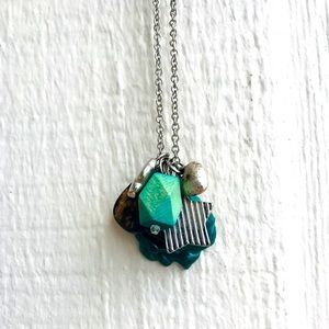 Necklace with green stones and charms